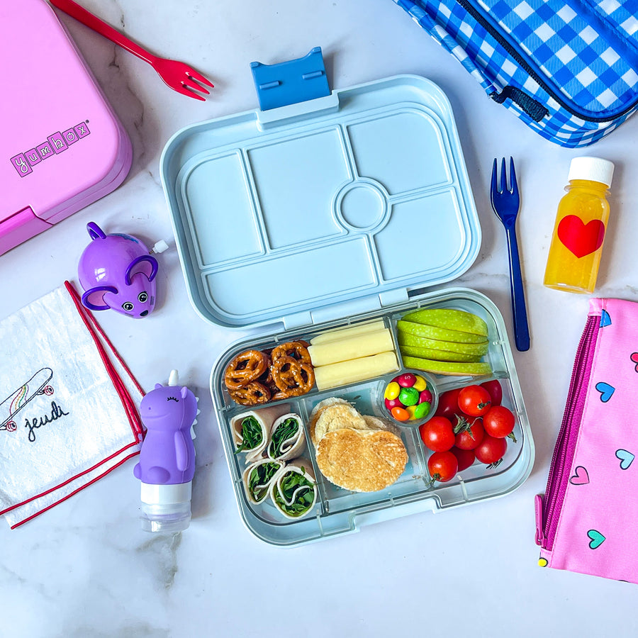 Yumbox original light blue kids lunch box with snacks inside of it