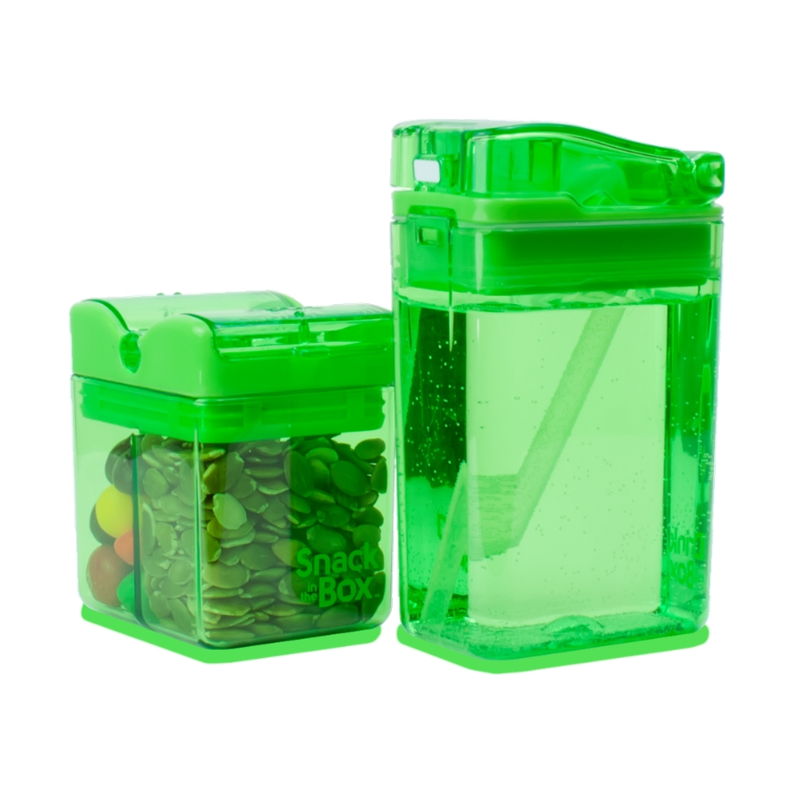 Two green transparent snack containers with snacks inside on a white background