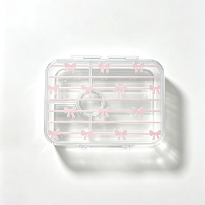 A clear plastic cosmetic organizer tray with a lid decorated with small pink bow patterns, shown on a clean white background with a soft shadow.