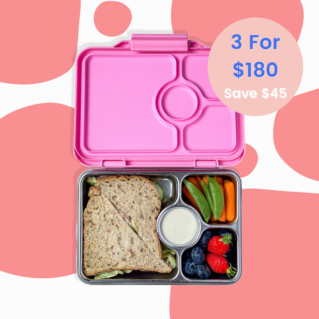 Pink bento box with a sandwich and vegetables on a pink background with promotional text.