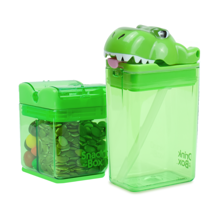 Green dinosaur-shaped snack container with a smaller transparent container inside on a white background